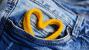 A picture of some jeans with heart shaped fabric tucked into the back pocket